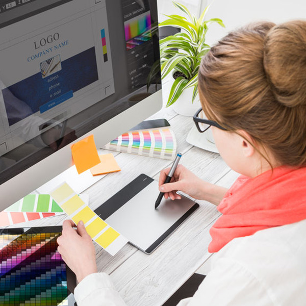 a graphic designer at her computer designing a logo