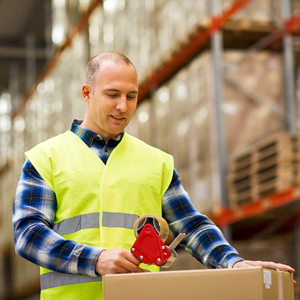 Worker prepares logistic delivery shipment package.